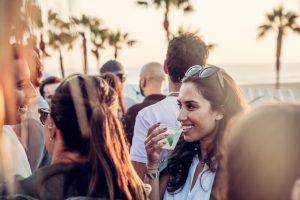 Guests socializing on the rooftop patio at Stay Open Venice beach